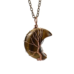 Close-up of handmade bronze wire-wrapped Tree of Life on Tiger Eye crescent moon pendant
