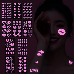 Fluoreszierende rosa Tattoo Aufkleber mit Herz und LOVE Motiven für Party Glow Effekte