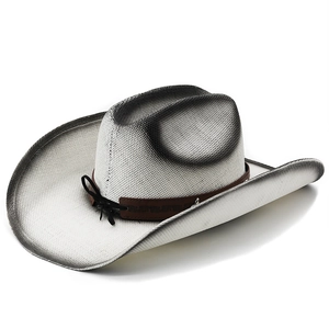 Detail of woven straw cowboy hat with black gradient brim and decorative band