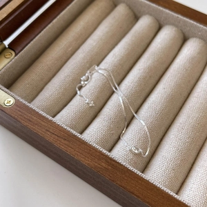 Elegant 925 sterling silver box chain bracelet with a round zircon in a wooden jewelry box