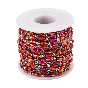 Detailed view of colorful faceted beads on a stainless steel chain for DIY jewelry making