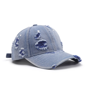 Vintage washed light blue denim baseball cap with distressed ripped holes and a wide brim