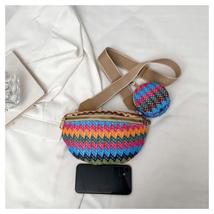 Detail of woven fanny pack set with colorful wave pattern and small coin purse
