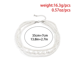 Detailed view of triple-layered baroque pearl necklace with silver clasp and size info