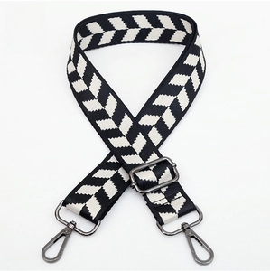 Detail of jacquard weave strap with black and white herringbone pattern and gunmetal hooks