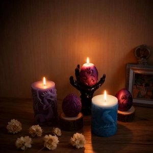 Gothic cylinder dragon and raven embossed candles with claw stand and wood base