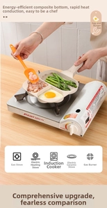 Three-hole non-stick maifan stone pan frying eggs, shrimp, and asparagus on a gas stove