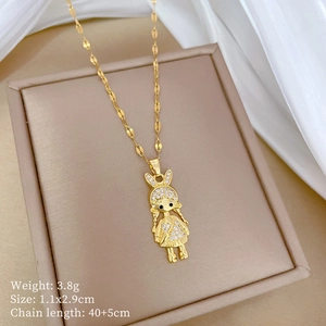 Detailed view of girl pendant necklace with diamonds on a beige jewelry box backdrop