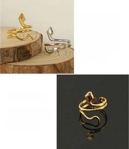 Macro detail of 18K gold plated snake ring showing eco-friendly stainless steel texture