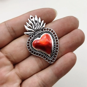 Gothic style flaming heart pendant with red center and vintage silver alloy details