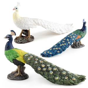 Realistic peacock animal figurines set with white and blue-green feathers on rock bases
