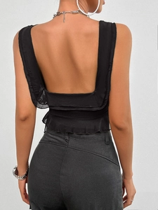 Back view of black Y2K sleeveless crop top with ruffle hem and elegant square neckline
