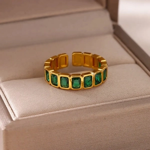 Elegant gold open ring featuring eight emerald-cut green zircons for a vintage luxury look
