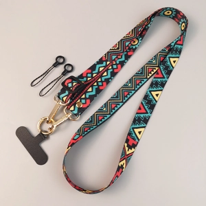 Adjustable crossbody phone lanyard with colorful ethnic geometric patterns and gold metal clasp