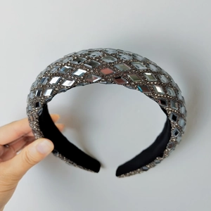 Close-up of sparkling silver rhinestones and fine crystal details on a luxury headband