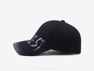 Close-up of a black washed baseball cap featuring white graffiti style BEST lettering on side