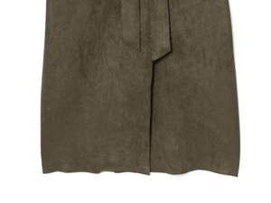 Detail of olive green faux suede coat featuring smooth hemline and matching decorative ties