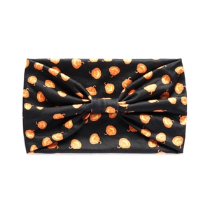 Detail of wide black headband with orange pumpkin pattern and festive bow design