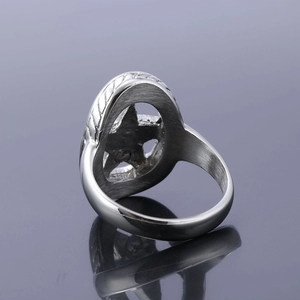 Close-up of silver stainless steel star ring with hollow pentagon and brushed metal finish