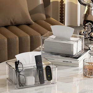 Modern transparent acrylic tissue box and organizer on a stylish marble tabletop