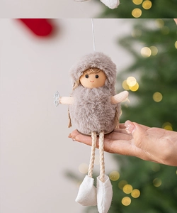 Close-up of plush angel doll with faux fur hood and sequin snowflake for Christmas tree