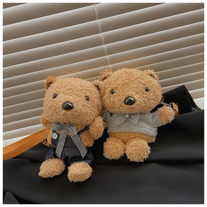 Detailed close-up of cute plush teddy bear crossbody bags in denim and grey outfits