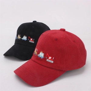 Detail of embroidered cartoon truck on red and black children's cotton baseball caps