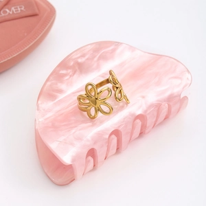 Detailed close-up of 18K gold-plated stainless steel hollow floral adjustable open ring