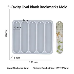 Detailed view of 5-cavity oval bookmark silicone mold with dimensions and resin sample