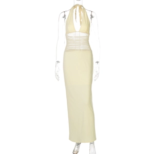 Detail of light yellow halter dress showing pleated mesh texture and waist craftsmanship
