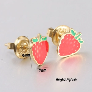 Macro shot of 9mm x 7mm strawberry stud earrings in red enamel and gold finish