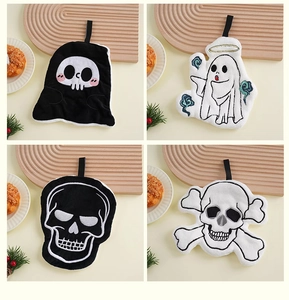Detail view of coral fleece Halloween hand towels in skull and ghost cartoon patterns