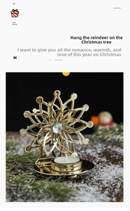 Close-up of golden snowflake metal candle holder with crystal center on snowy surface