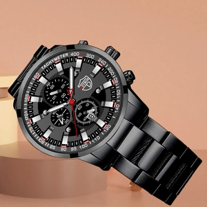 Detail of black stainless steel quartz watch dial with luminous hands and date window