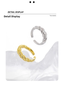 Detailed macro view of S925 sterling silver twist rings showing the engraved hallmark