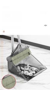 Detail view of transparent dustpan with 35 long comb teeth for hair and debris removal