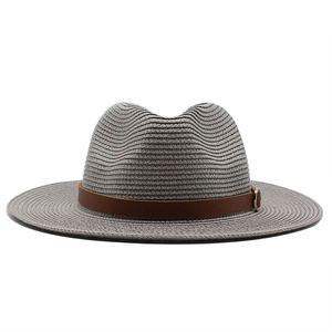 Detail of grey fedora straw hat featuring a brown leather band with silver buckle detail