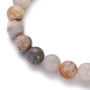 Macro shot of 8-10mm natural agate beads showing unique textures and earthy mineral tones