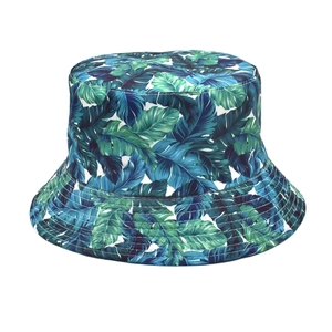 Close-up of tropical palm leaf print and canvas fabric texture on the sun bucket hat