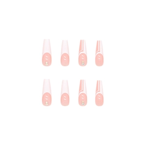Pink and white French press-on nails with minimalist geometric lines and rhinestones