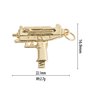Detailed view of a gold Uzi shaped pendant with precise 22.1mm by 16.9mm dimensions