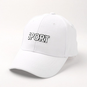 Close-up of white baseball cap with black SPORT embroidery and jacquard fabric details