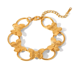 Detailed close-up of golden butterfly links on adjustable stainless steel bracelet