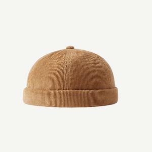 Brown corduroy docker hat for men and women featuring a minimalist retro skullcap design