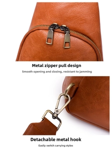 Detail of retro brown PU leather chest bag with dual zippers and metal swivel hooks