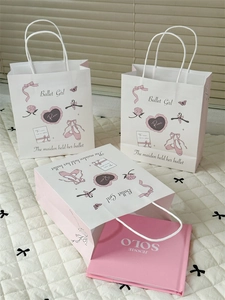 Detail of ballet themed paper gift bags with pink handles and floral illustrations