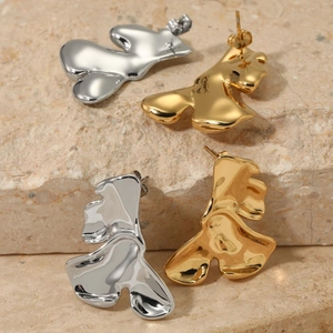 Irregular 316 stainless steel earrings in gold and silver with fluid metal design
