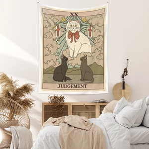 Detail of Judgement cat tarot tapestry hanging over a bed in a cozy bedroom