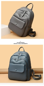 Detail of greyish-blue lychee grain leather backpack with zip pockets and front flap pocket