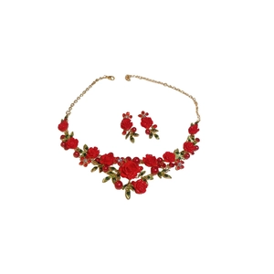 Floral jewelry set featuring red roses, green leaves, and pearls on a white background
